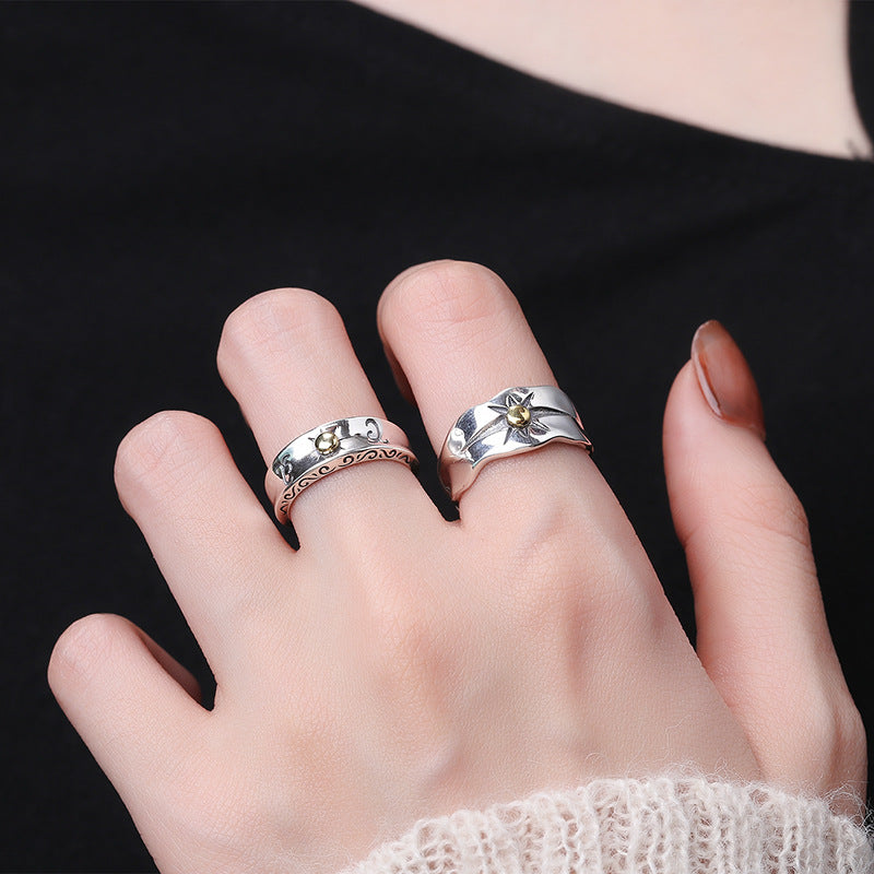 Origsoul sun ray ring silver worn on finger with textured silver design and gold sun detail
