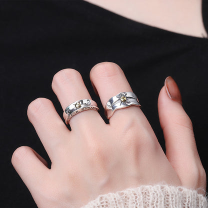 Origsoul sun ray ring silver worn on finger with textured silver design and gold sun detail