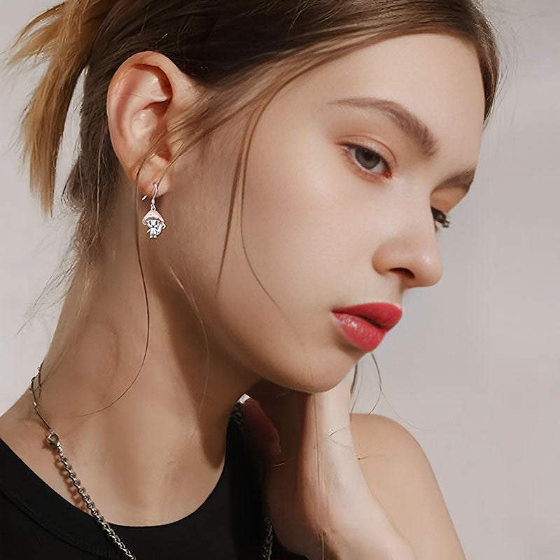 Origsoul whimsical mushroom charm earrings worn by woman with natural makeup and red lipstick