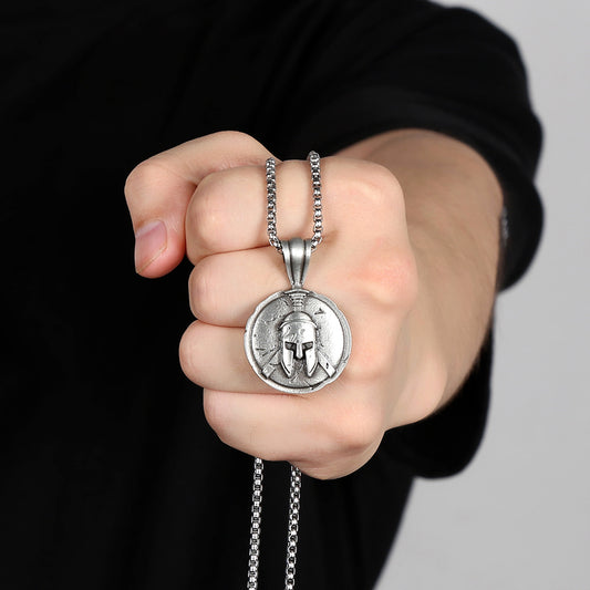 Origsoul Viking knot pendant necklace with a detailed warrior helmet design held in hand