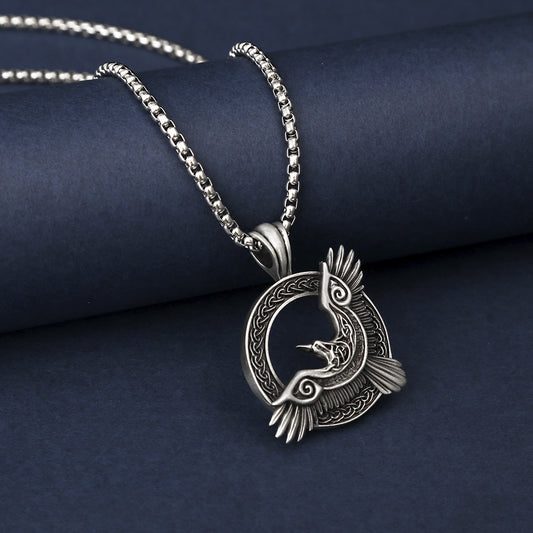 Origsoul Viking raven pendant necklace in silver with detailed bird design and intricate circular pattern