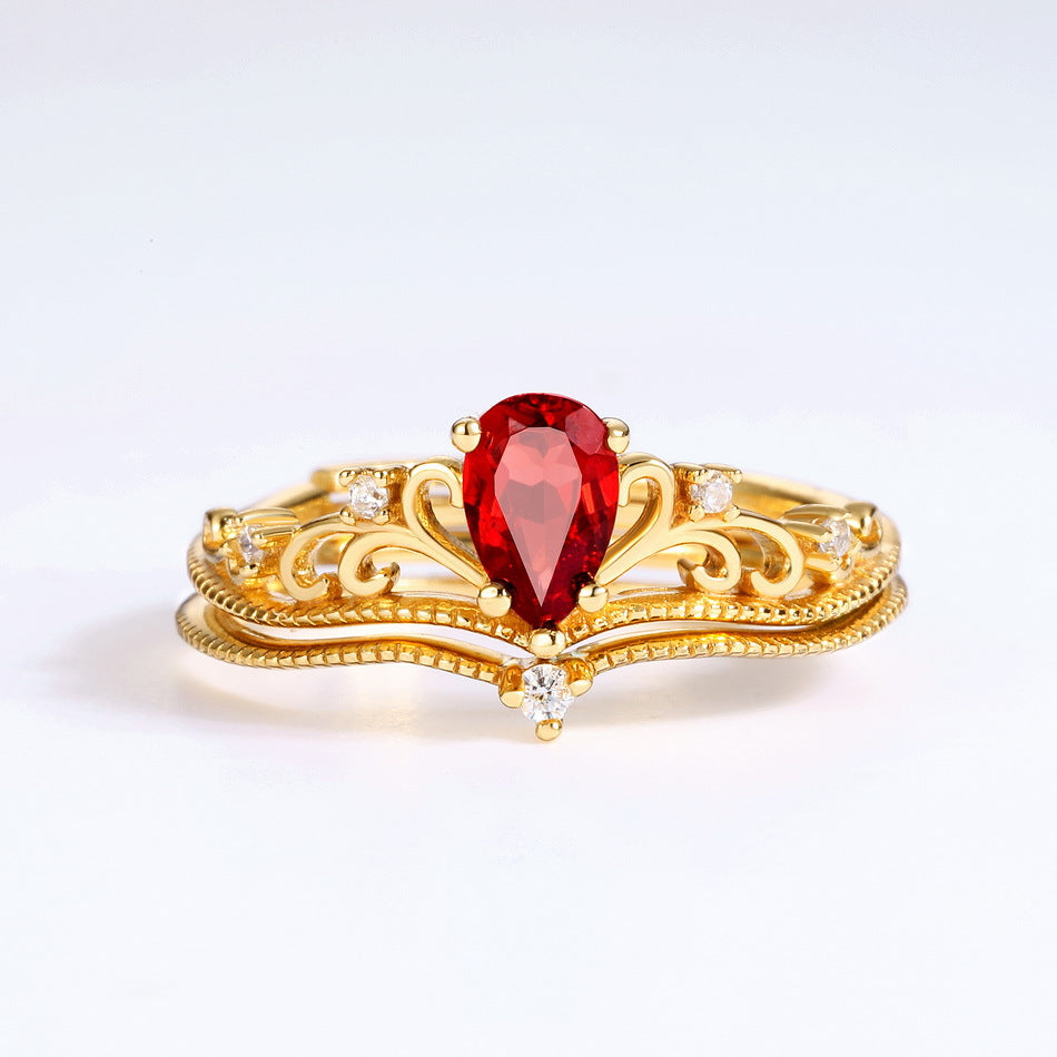 Origsoul vintage engagement ring with red teardrop gemstone and intricate gold design