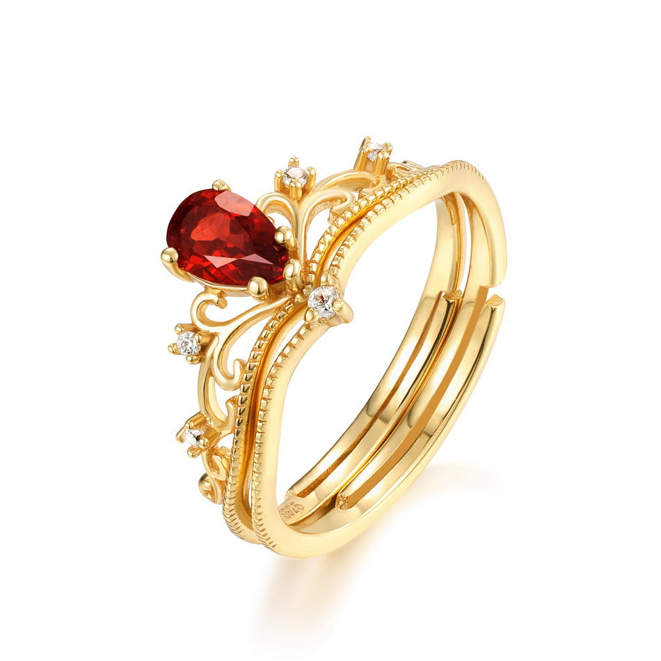 Origsoul vintage engagement ring with gold band and pear-shaped red gemstone centerpiece