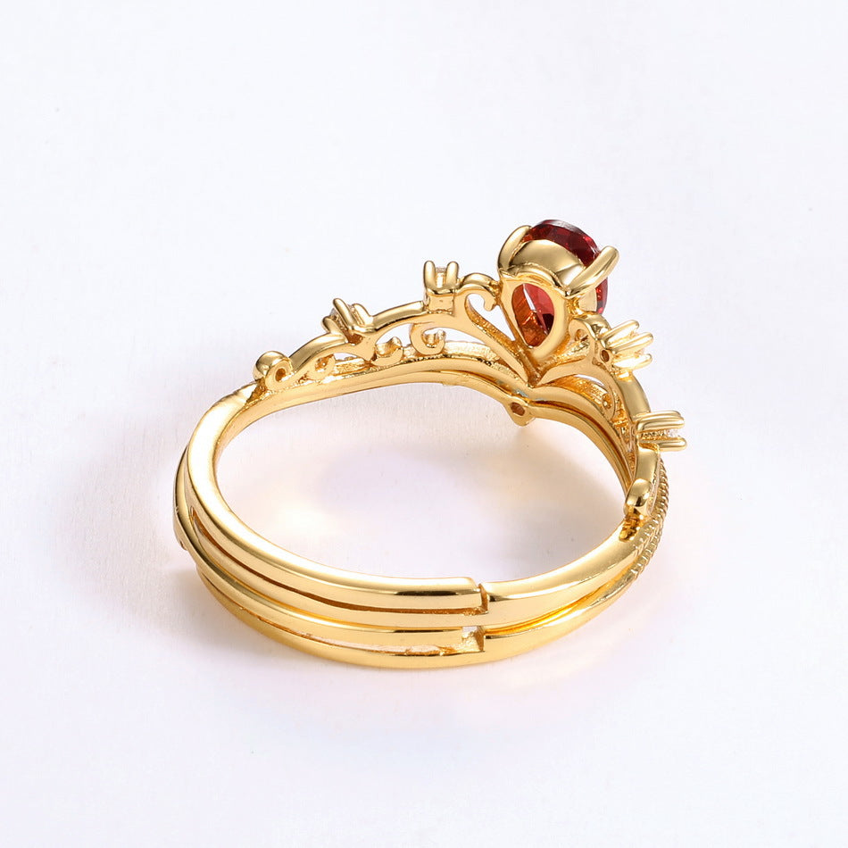 Origsoul vintage engagement ring with intricate gold design and red gemstone centerpiece